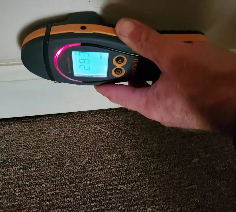 Moisture detection at baseboard during Burst Pipe Cleanup in Trinidad